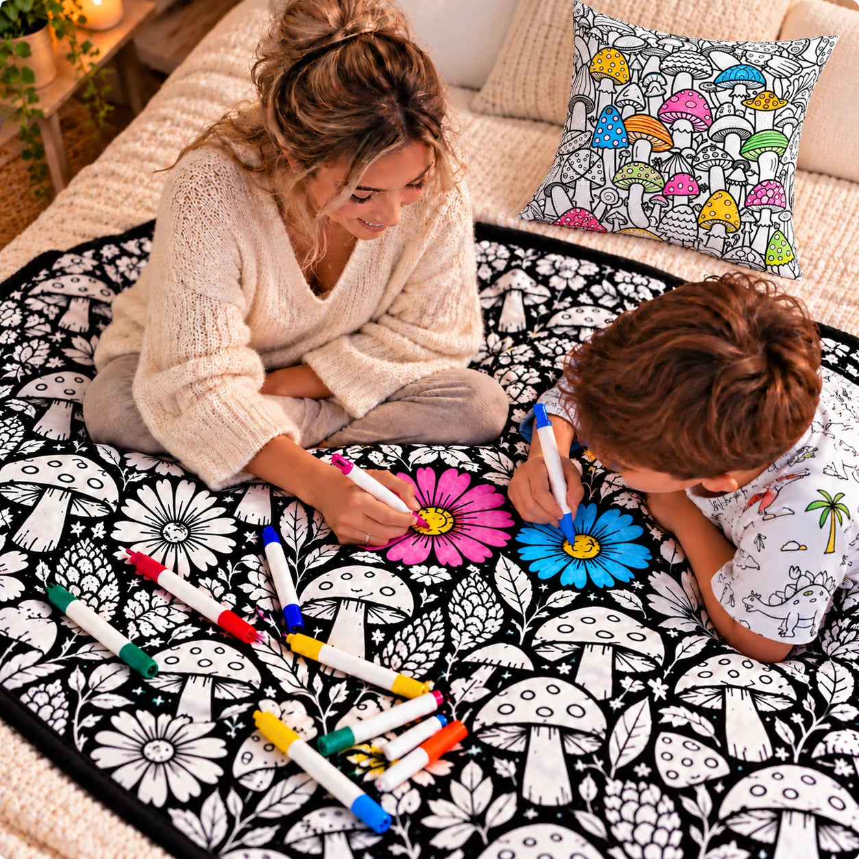 Woman and child colouring a floral blanket with square floral pillow